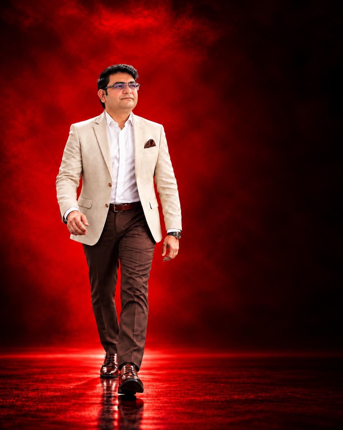 Aadesh Sharma walking towards the camera in a cream blazer